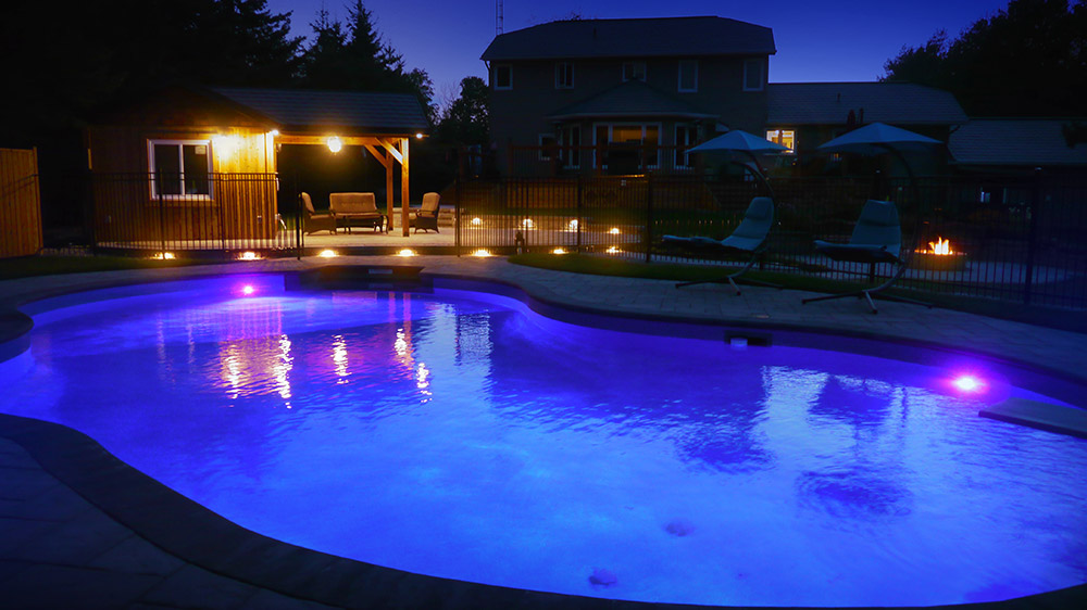 Luxury pool house lighting at night